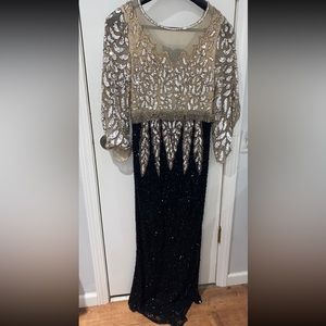 Selling this beautiful black/silver gown that has only been worn once. Size 18